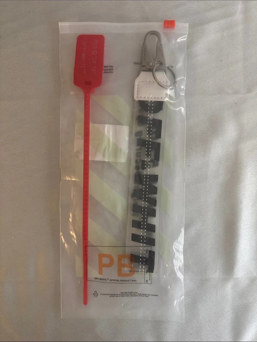New! Off-White White Nylon Key Strap with Black Diagonal Text and Red Zip Tie